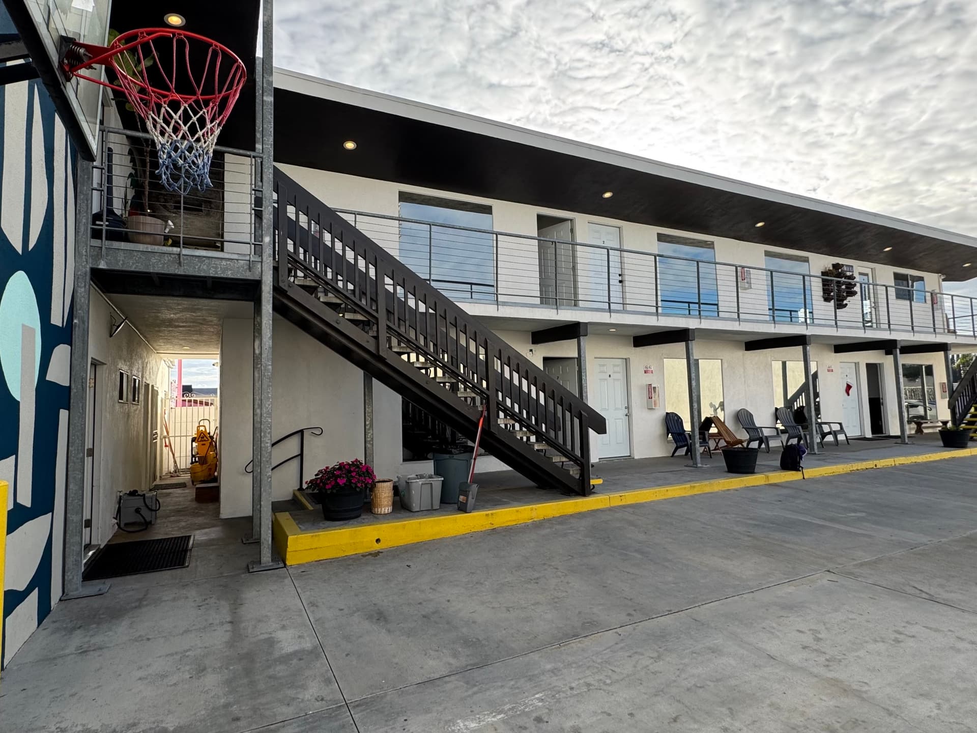 Basketball hoop and outdoor recreation area at the facility.